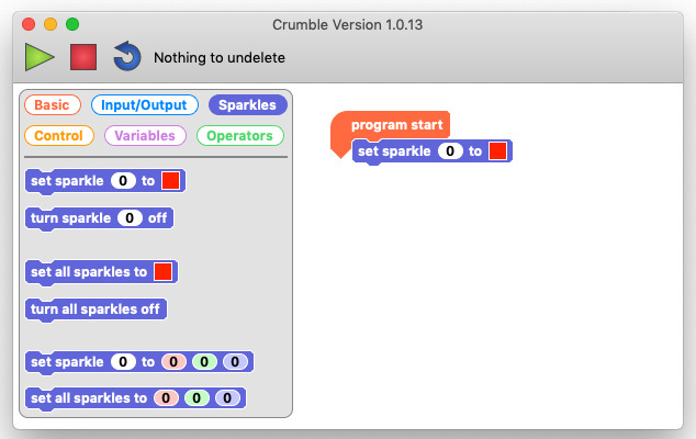 A screenshot of the Crumble programming environment. A 'set sparkle 0 to red' code block is connected below the program start block in the program workspace.